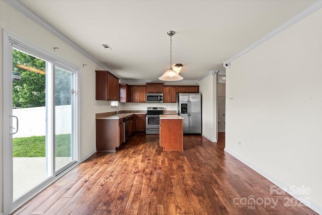 2515 Walnut Forest Dr, Charlotte, NC 28216 - kitchen featuring stainless steel appliances, crown molding, dark wood-style floors, light countertops, and hanging light fixtures