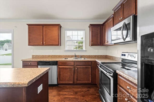 2515 Walnut Forest Dr, Charlotte, NC 28216 - kitchen with appliances with stainless steel finishes, dark wood-style floors, crown molding, and light countertops