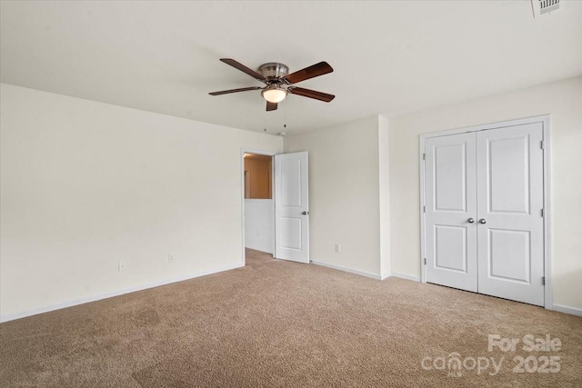 2515 Walnut Forest Dr, Charlotte, NC 28216 - unfurnished bedroom with carpet, a closet, and a ceiling fan