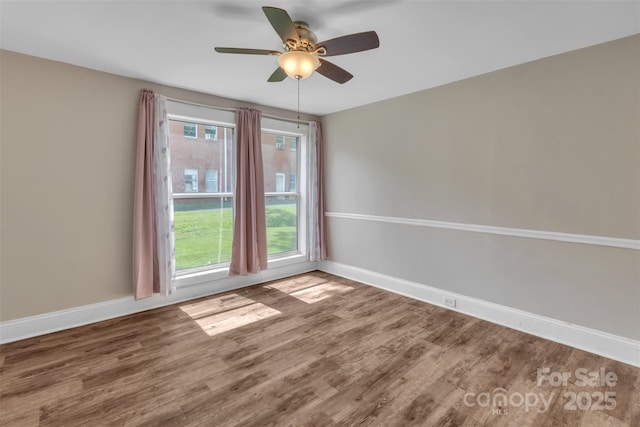 111 E Church St, Stanley, NC 28164 - unfurnished room with baseboards, wood finished floors, and ceiling fan