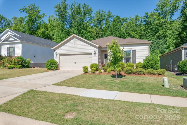 7530 Porrera St, Charlotte, NC 28214 - ranch-style home featuring a garage, concrete driveway, and a front lawn