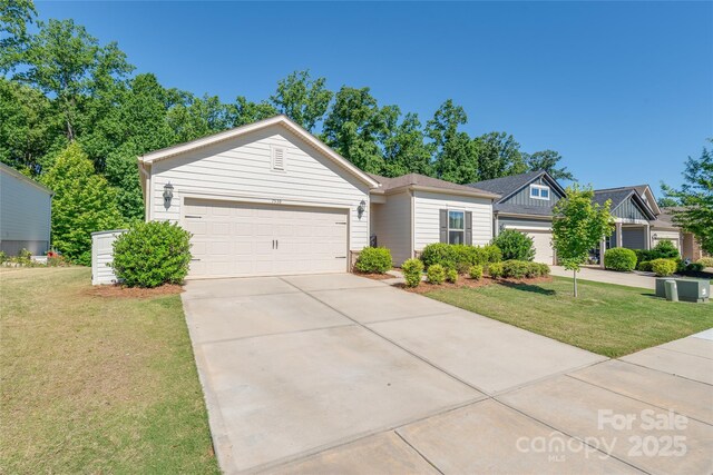 7530 Porrera St, Charlotte, NC 28214 - single story home featuring a front lawn, driveway, and a garage