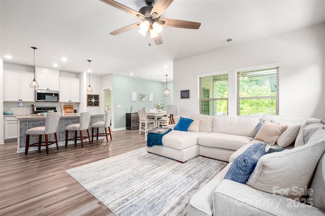 7530 Porrera St, Charlotte, NC 28214 - living area with recessed lighting, light wood-style floors, and a ceiling fan