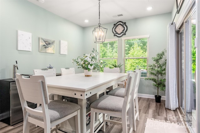 7530 Porrera St, Charlotte, NC 28214 - dining room with wood finished floors, plenty of natural light, recessed lighting, and a chandelier