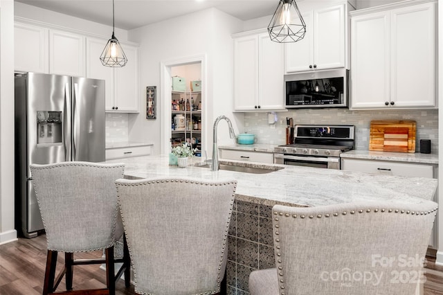 7530 Porrera St, Charlotte, NC 28214 - kitchen featuring stainless steel appliances, dark wood finished floors, backsplash, and light stone countertops