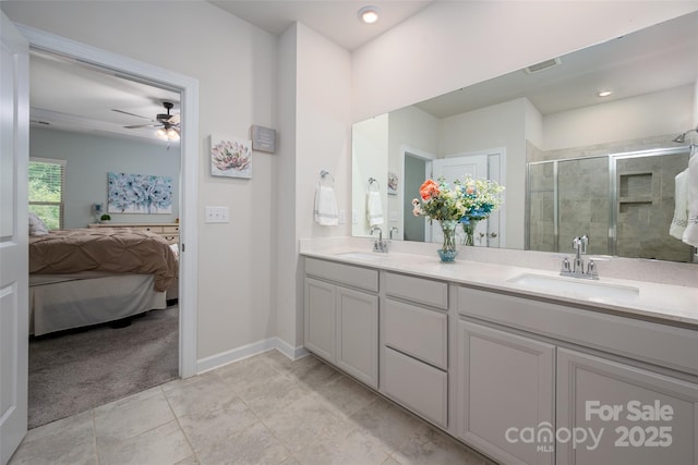 7530 Porrera St, Charlotte, NC 28214 - ensuite bathroom with ceiling fan, double vanity, a shower stall, and tile patterned floors
