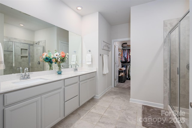 7530 Porrera St, Charlotte, NC 28214 - full bathroom featuring a stall shower, double vanity, and a spacious closet