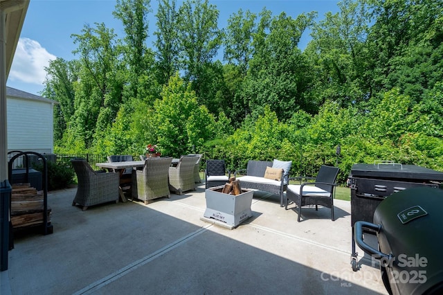 7530 Porrera St, Charlotte, NC 28214 - view of patio with outdoor dining area and an outdoor living space with a fire pit