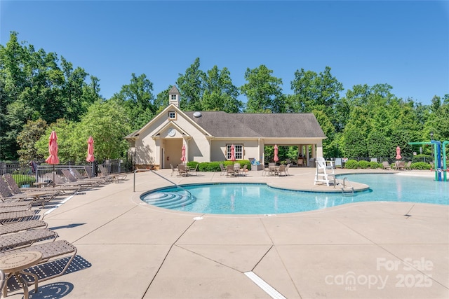 7530 Porrera St, Charlotte, NC 28214 - community pool with a patio area and view of wooded area