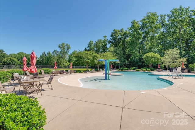 7530 Porrera St, Charlotte, NC 28214 - community pool with a patio and view of wooded area
