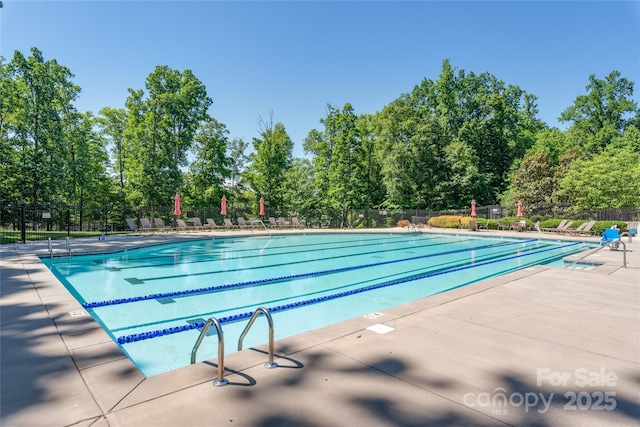 7530 Porrera St, Charlotte, NC 28214 - community pool with view of wooded area and a patio
