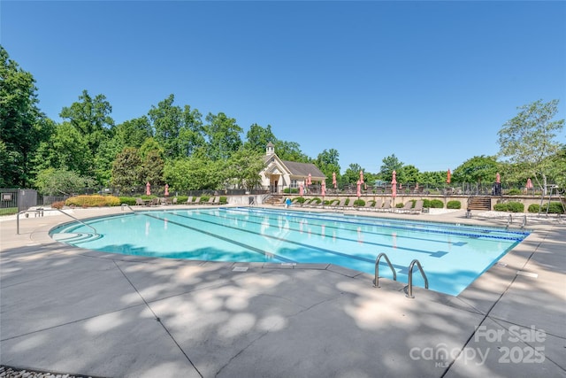 7530 Porrera St, Charlotte, NC 28214 - community pool featuring a patio area