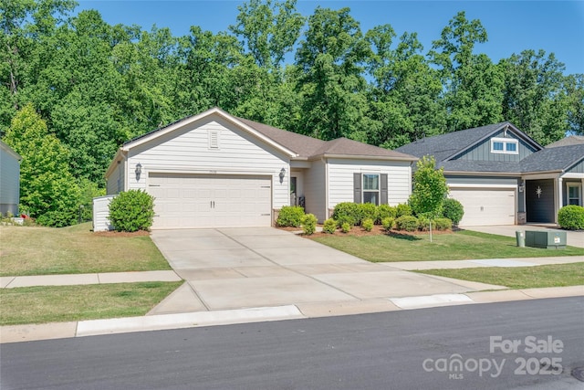7530 Porrera St, Charlotte, NC 28214 - ranch-style home featuring a garage, concrete driveway, and a front yard