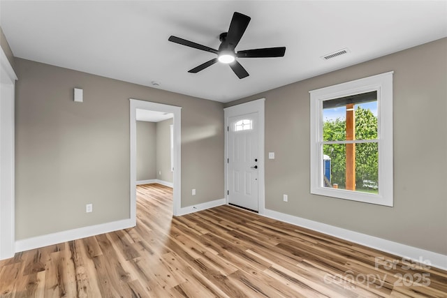 entrance foyer featuring baseboards, light wood finished floors, and ceiling fan