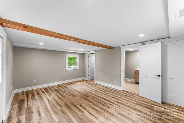basement with light wood finished floors, recessed lighting, and baseboards
