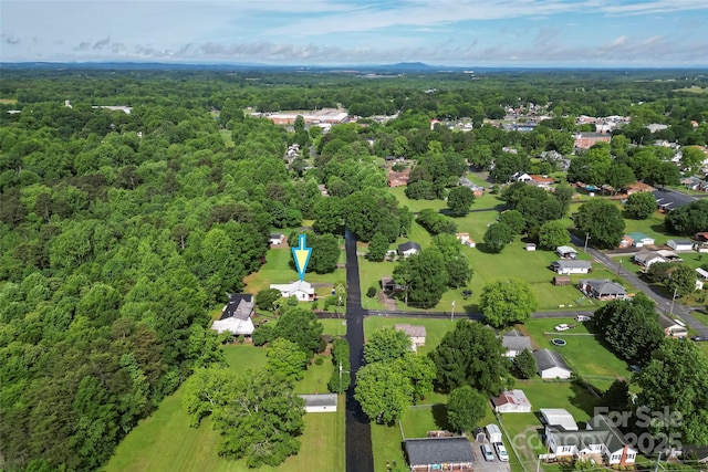 drone / aerial view of a heavily wooded area