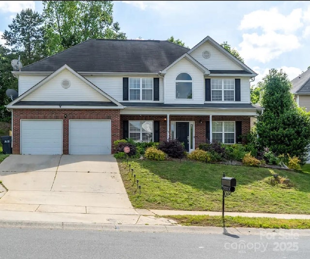 5227 Eagle Creek Dr, Charlotte, NC 28269 - view of front of home featuring brick siding, a garage, driveway, and a front lawn