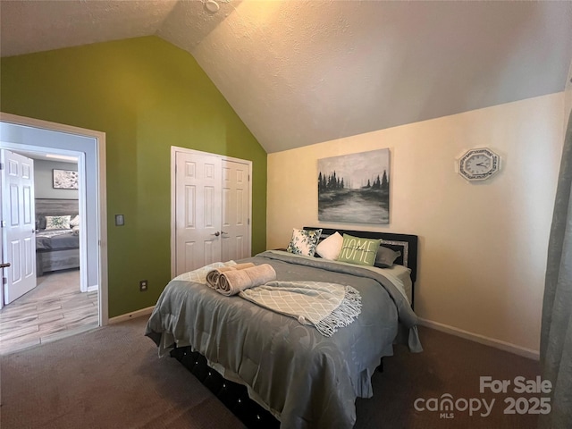 5227 Eagle Creek Dr, Charlotte, NC 28269 - bedroom featuring vaulted ceiling, carpet floors, baseboards, and a closet