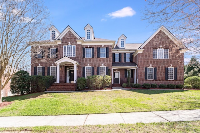 5004 Woodview Ln, Matthews, NC 28104 - colonial house featuring brick siding and a front yard