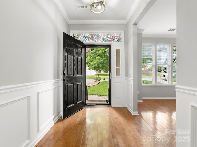 3038 Sterling Ct, Fort Mill, SC 29707 - entrance foyer featuring ornamental molding, light wood-type flooring, and wainscoting