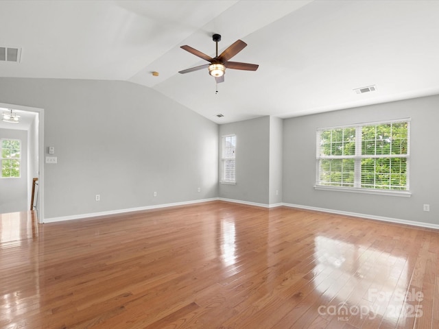 3038 Sterling Ct, Fort Mill, SC 29707 - spare room featuring ceiling fan, light wood-style floors, vaulted ceiling, baseboards, and a chandelier