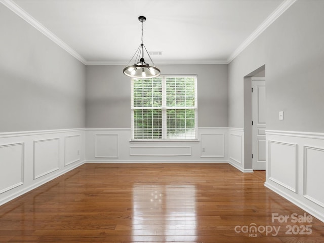 3038 Sterling Ct, Fort Mill, SC 29707 - unfurnished dining area with ornamental molding, wood finished floors, and wainscoting
