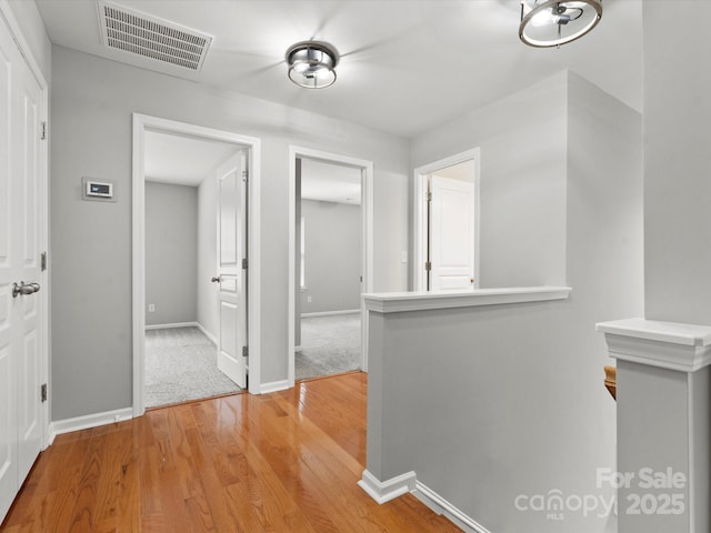 3038 Sterling Ct, Fort Mill, SC 29707 - hallway featuring an upstairs landing, light wood-style flooring, and baseboards