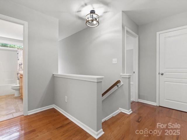 3038 Sterling Ct, Fort Mill, SC 29707 - hall with an upstairs landing, baseboards, and wood finished floors