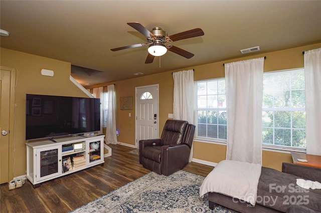 4075 Clover Rd NW, Concord, NC 28027 - living area featuring wood finished floors, a ceiling fan, healthy amount of natural light, and baseboards