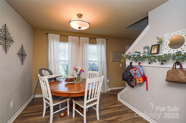 4075 Clover Rd NW, Concord, NC 28027 - dining room with dark wood-type flooring and baseboards