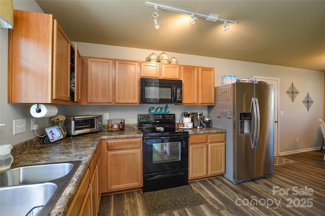 4075 Clover Rd NW, Concord, NC 28027 - kitchen featuring black appliances, dark wood-style floors, track lighting, a sink, and dark countertops
