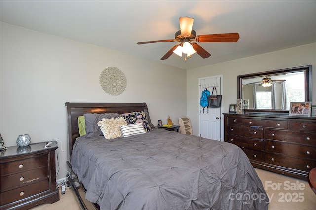 4075 Clover Rd NW, Concord, NC 28027 - bedroom with light colored carpet and a ceiling fan