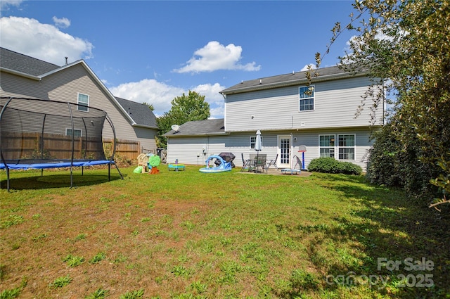 4075 Clover Rd NW, Concord, NC 28027 - back of property featuring a trampoline and a patio