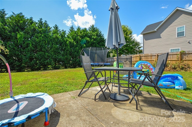 4075 Clover Rd NW, Concord, NC 28027 - view of patio / terrace featuring a trampoline and outdoor dining space