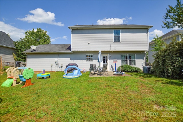 4075 Clover Rd NW, Concord, NC 28027 - back of house featuring central AC, a patio area, and a yard