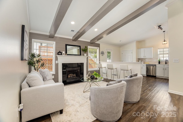 1776 Baylor Dr, Rock Hill, SC 29732 - living room featuring dark wood-style flooring, a fireplace with flush hearth, healthy amount of natural light, ornamental molding, and baseboards