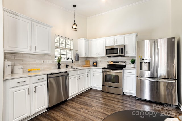 1776 Baylor Dr, Rock Hill, SC 29732 - kitchen with appliances with stainless steel finishes, a sink, white cabinetry, light countertops, and ornamental molding