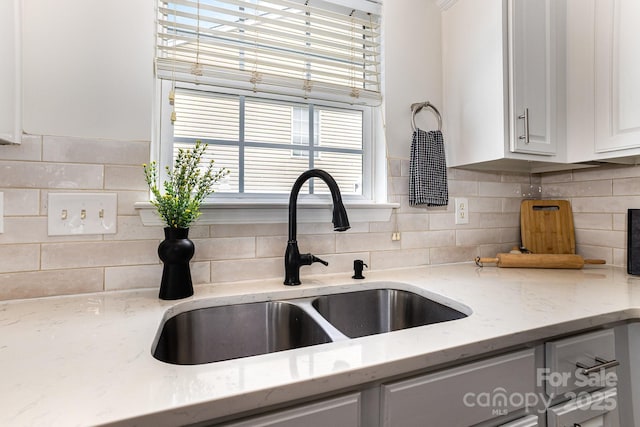 1776 Baylor Dr, Rock Hill, SC 29732 - kitchen with white cabinetry, tasteful backsplash, and light stone countertops