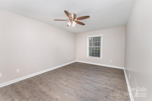 unfurnished room with ceiling fan, baseboards, and wood finished floors
