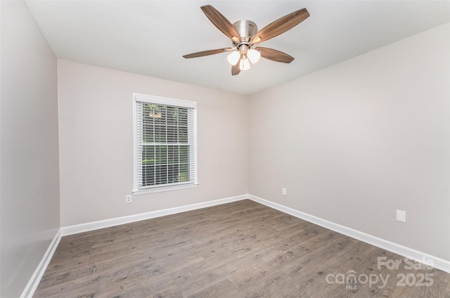 unfurnished room featuring wood finished floors, baseboards, and ceiling fan