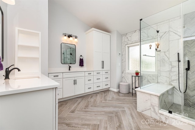 9593 Indian Beech Ave NW, Concord, NC 28027 - full bathroom featuring a marble finish shower, two vanities, and baseboards