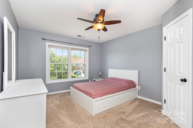 9593 Indian Beech Ave NW, Concord, NC 28027 - bedroom featuring light carpet, baseboards, and a ceiling fan