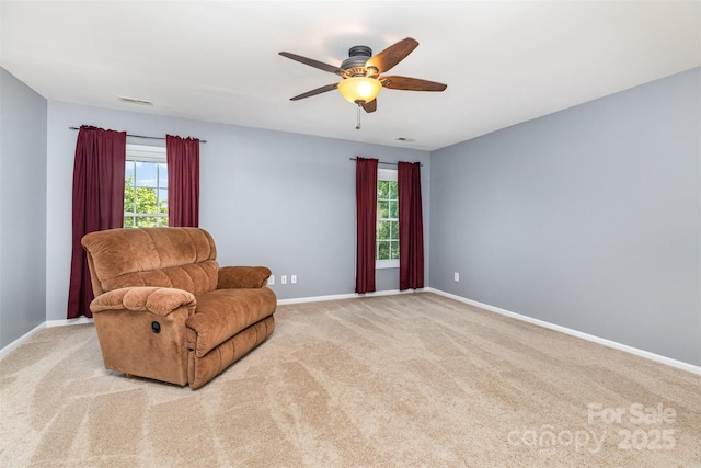 9593 Indian Beech Ave NW, Concord, NC 28027 - living area featuring carpet, a ceiling fan, and baseboards