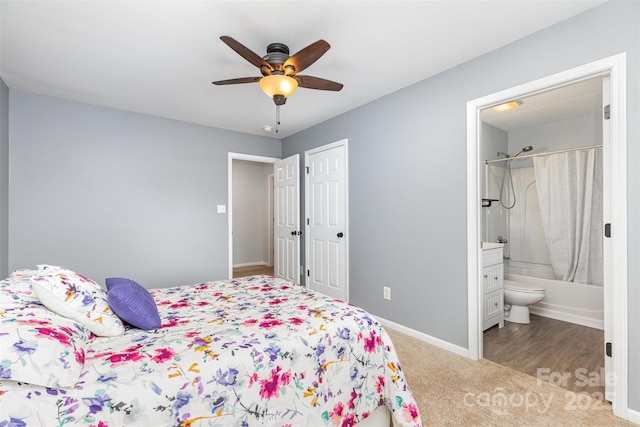 9593 Indian Beech Ave NW, Concord, NC 28027 - carpeted bedroom with ensuite bath, baseboards, a ceiling fan, and a closet