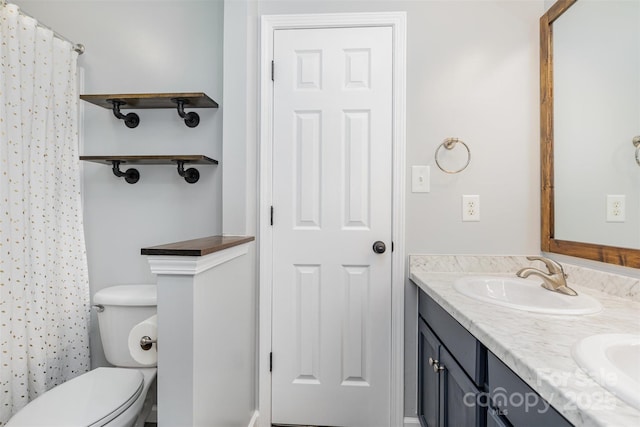 9593 Indian Beech Ave NW, Concord, NC 28027 - bathroom featuring double vanity, toilet, and curtained shower