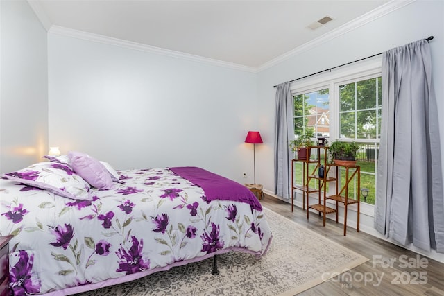 9593 Indian Beech Ave NW, Concord, NC 28027 - bedroom with ornamental molding, wood finished floors, and baseboards