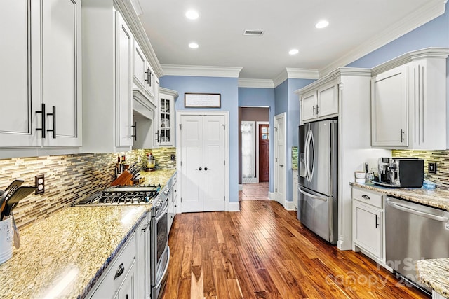 5163 Meadow Park Ln, Hickory, NC 28602 - kitchen featuring stainless steel appliances, light stone counters, decorative backsplash, dark wood-style floors, and glass insert cabinets