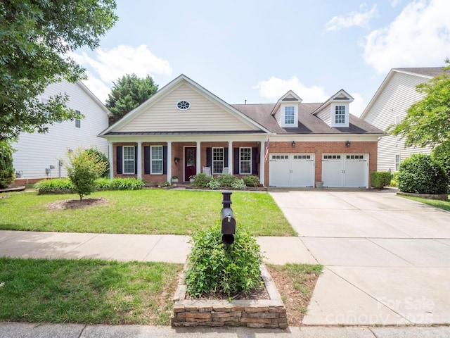 8605 Soaring Eagle Ln, Waxhaw, NC 28173 - view of front of house with an attached garage, concrete driveway, covered porch, a front lawn, and brick siding
