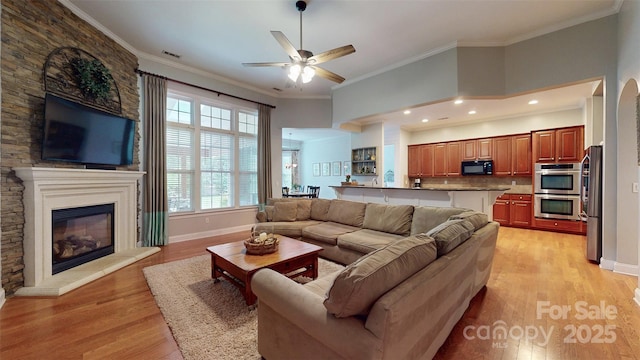 8605 Soaring Eagle Ln, Waxhaw, NC 28173 - living area with a ceiling fan, light wood-type flooring, crown molding, and baseboards