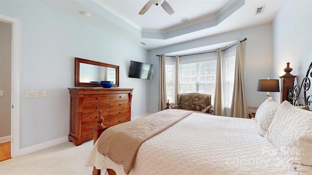 8605 Soaring Eagle Ln, Waxhaw, NC 28173 - bedroom with a raised ceiling, crown molding, light carpet, baseboards, and a ceiling fan